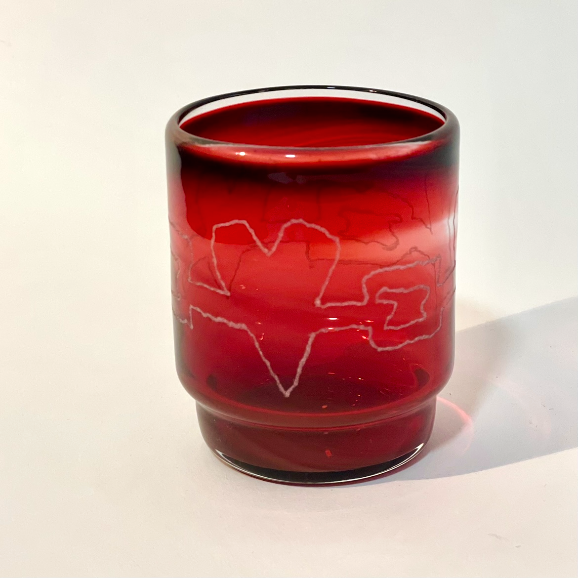 ruby glass tumbler engraved with a heart and chain motif